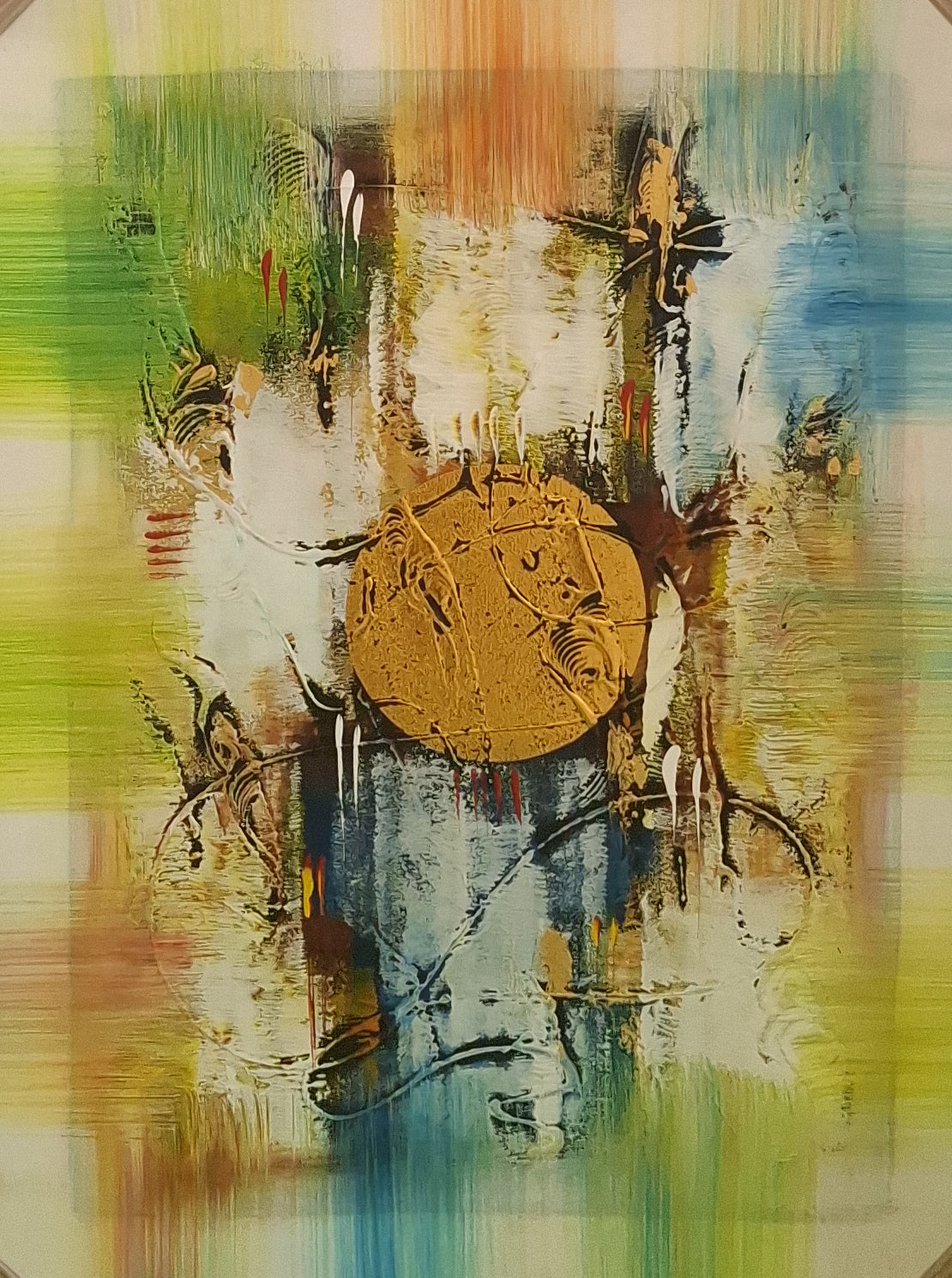 Abstract art with a central gold circle surrounded by colorful brush strokes