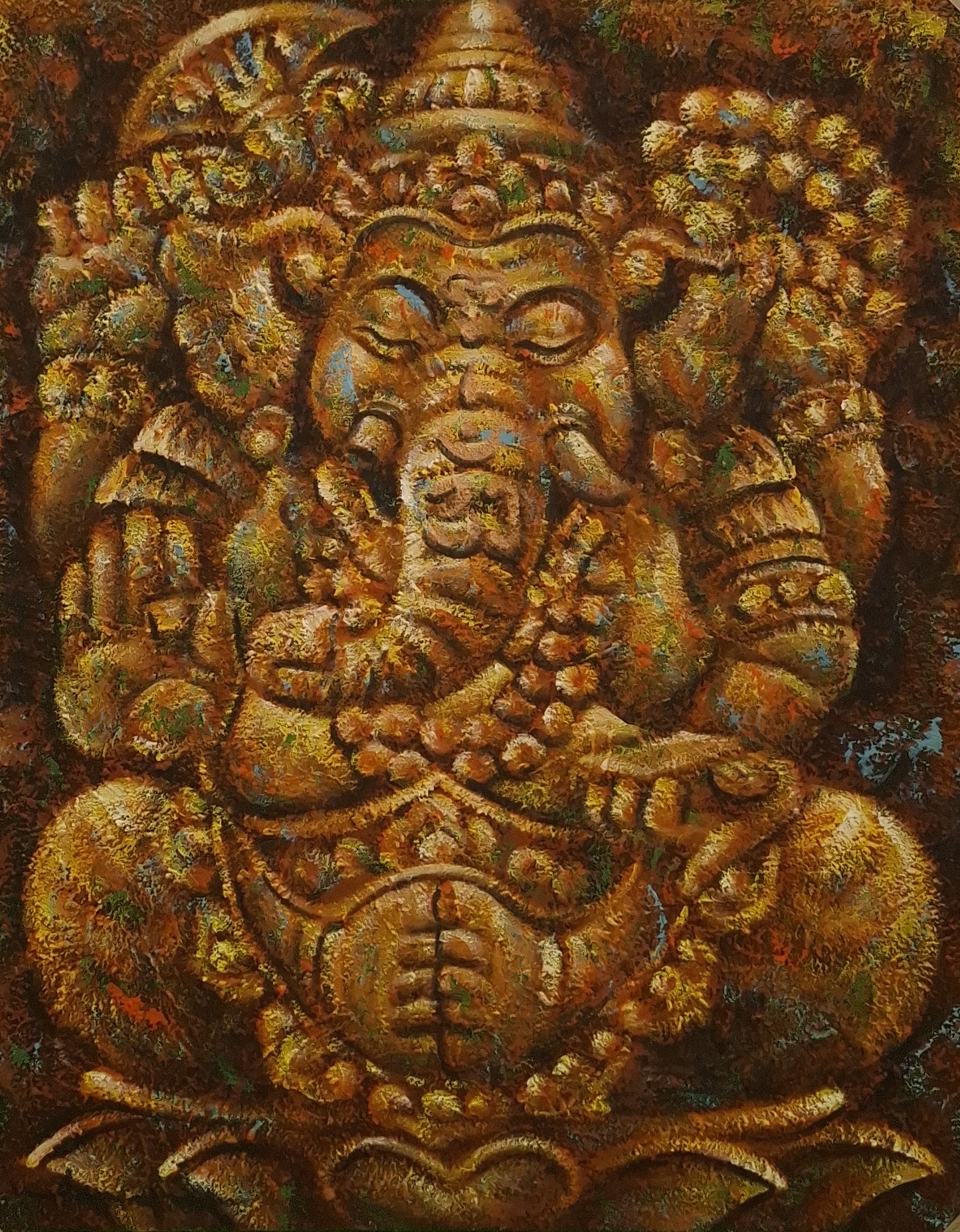 Decorative relief sculpture of a deity with intricate details on a textured background