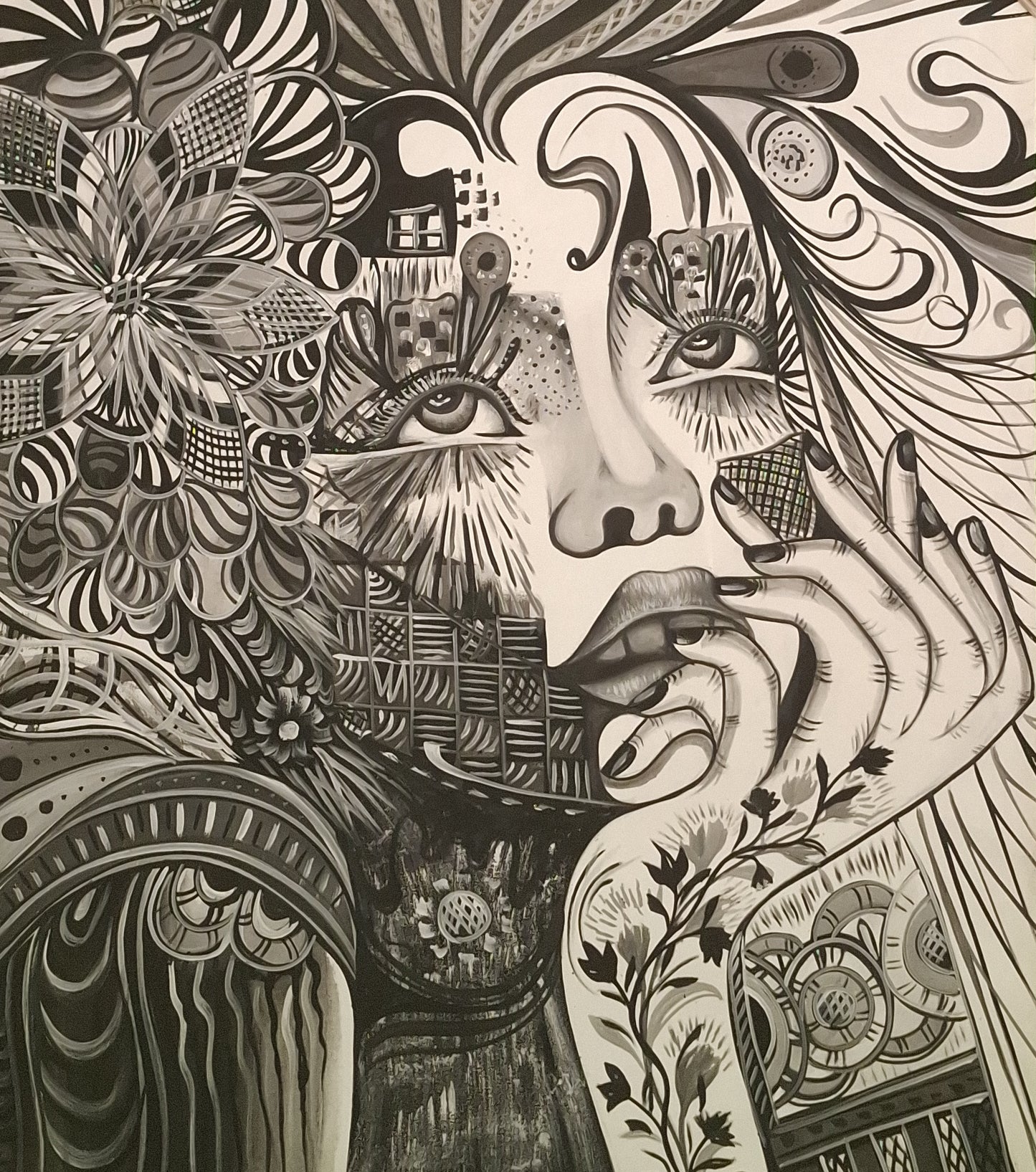 Black and white intricate artwork of a face with abstract patterns and symbols.