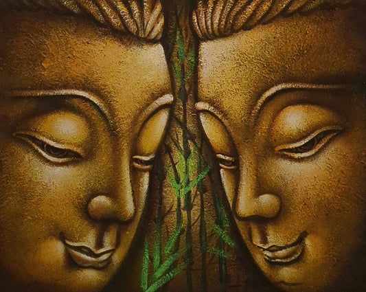 Bronze sculpture of two faces with a green leaf between them