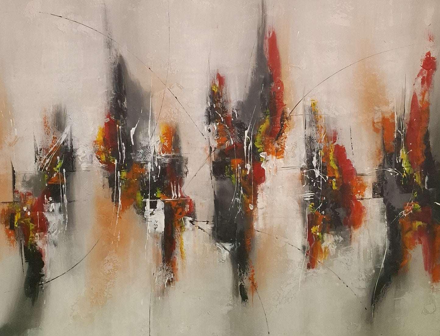 Abstract art with splashes of red, orange, and black on a light gray background