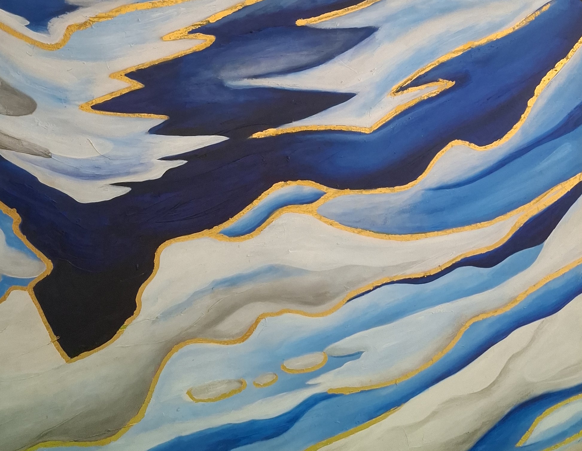 Abstract art with blue, white, and black colors on a textured surface.