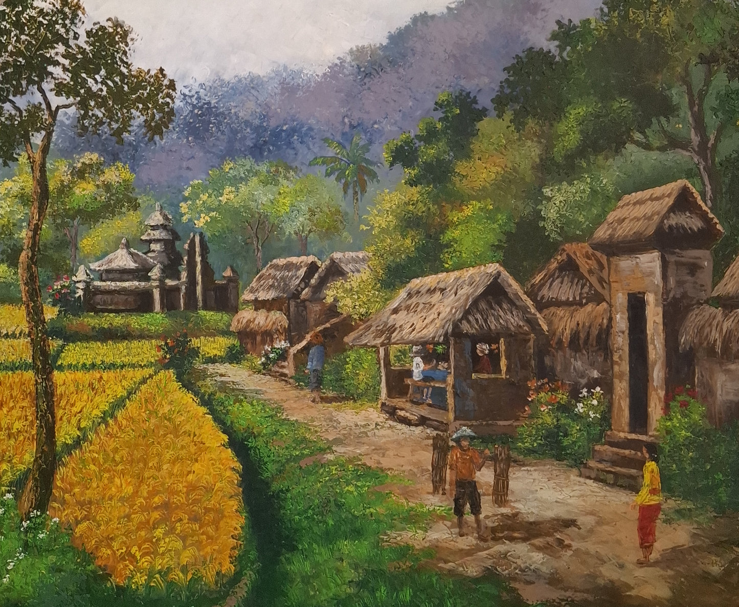 Village scene with thatched huts and people near a rice field